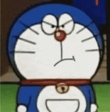 a close up of a doraemon cartoon character with an angry look on his face .