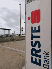 a white sign that says erste bank in blue and red