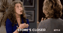 a woman talking to another woman with the words store 's closed