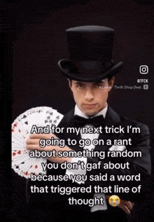 a man in a top hat holding a deck of playing cards