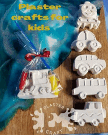 a bag of plaster crafts for kids , including a train , bus , and truck .