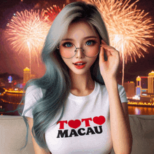 a woman wearing glasses and a toto macau t-shirt