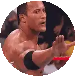 a man is standing in a ring with his hand outstretched .