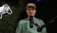 a man wearing an aloha design hat is standing in front of a microphone