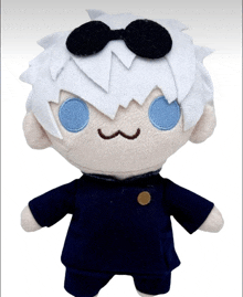 a stuffed toy with white hair and blue eyes is wearing sunglasses