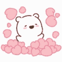 a white teddy bear is sitting in a pile of pink hearts .