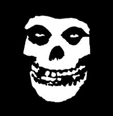 a black and white drawing of a skull with a smile