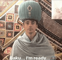 a man wearing a turban and a shawl says baku i 'm ready