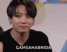 a close up of a person 's face with the words `` gamsahabida '' written on it .
