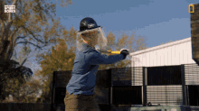 a man wearing a hard hat and a face shield is playing a game of baseball with breaking bobby bones