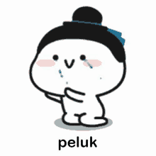 a cartoon character with a bun on his head is crying and has the word peluk written next to him .