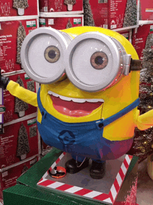 a statue of a minion in front of boxes that say t15