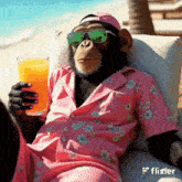 a chimpanzee wearing sunglasses and a pink shirt is sitting on a couch holding a glass of orange juice