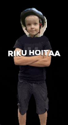 a young boy wearing a helmet and a shirt that says " riku hoitaa " on it