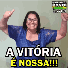 a woman giving a thumbs up with the words a vitoria e nossa on the bottom