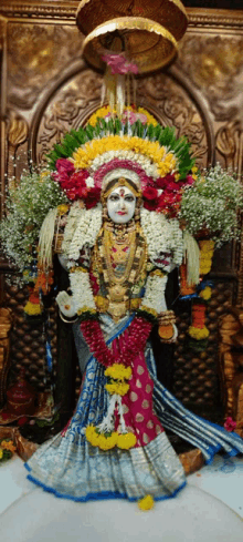 a statue of a woman with a crown of flowers