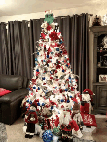 a christmas tree in a living room with a dash of snow sign