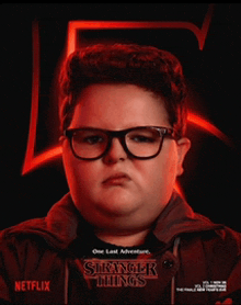a poster for netflix 's stranger things shows a boy with glasses