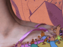 a close up of a person 's ear with a cartoon drawing of scooby doo on it