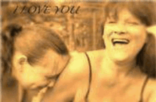 a couple of women are laughing together and the words `` i love you '' are on the bottom of the picture .