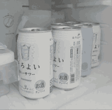 a can of suntory sits on a shelf with other cans