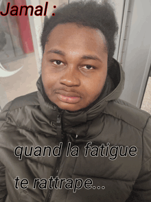 a man wearing a jacket with the name jamal written on it