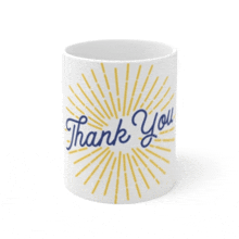 a white mug that says thank you with yellow rays behind it