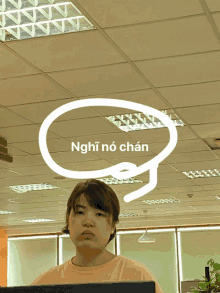 a woman stands in front of a ceiling with a speech bubble that says nghĩ no chan