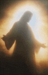 a silhouette of jesus with his hands outstretched