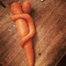 a carrot shaped like two people hugging each other