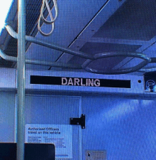 a sign that says darling on it on a bus