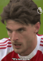 a close up of a man 's face with the words `` it 's not done '' written on the bottom .