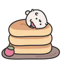 a stack of pancakes with a bear on top