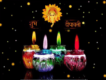 a picture of candles with a ganesha and the words " shubh deepavali " on the bottom