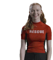 a girl is wearing a red shirt that says rescue