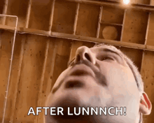 a close up of a man 's face with the words after lunnch written on the bottom