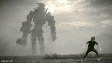 a man standing in front of a giant robot with imgflip.com at the bottom of the screen