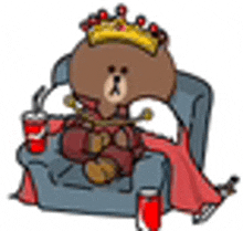 a brown bear wearing a crown is sitting in a chair with a drink .