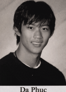 a black and white photo of a young man with the name da phục