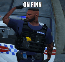 a police officer flexes his arm in front of a police car with the caption on finn above him