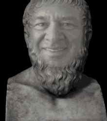 a statue of a man with a beard and a smile