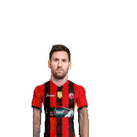 a man is wearing a red and black striped shirt with a soccer player on the sleeve