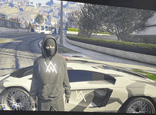 a person wearing a mask is standing in front of a car with the letter w on the side