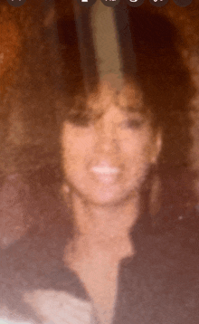 a blurred image of a woman with a circle around her head