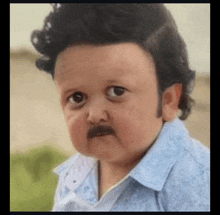 a baby with a fake mustache and a wig is making a funny face .
