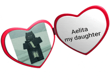 a heart shaped mirror with the words aelita my daughter written on it