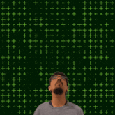 a man is looking up at the number 9