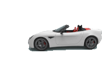 a white sports car with red seats and a red top