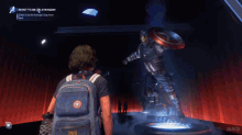 a man with a backpack stands in front of captain america in a video game