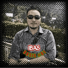 a man wearing sunglasses and a shirt that says ' ibas basis # 01 '